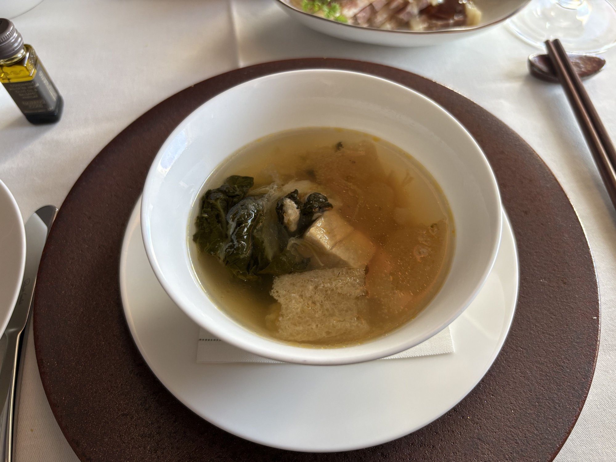 Double-boiled chicken soup with conpoy, pak choy and bamboo pith