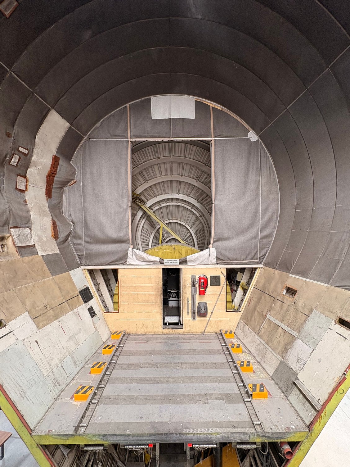 Inside the open nose of the Super Guppy - cockpit can just about be seen through the middle opening.