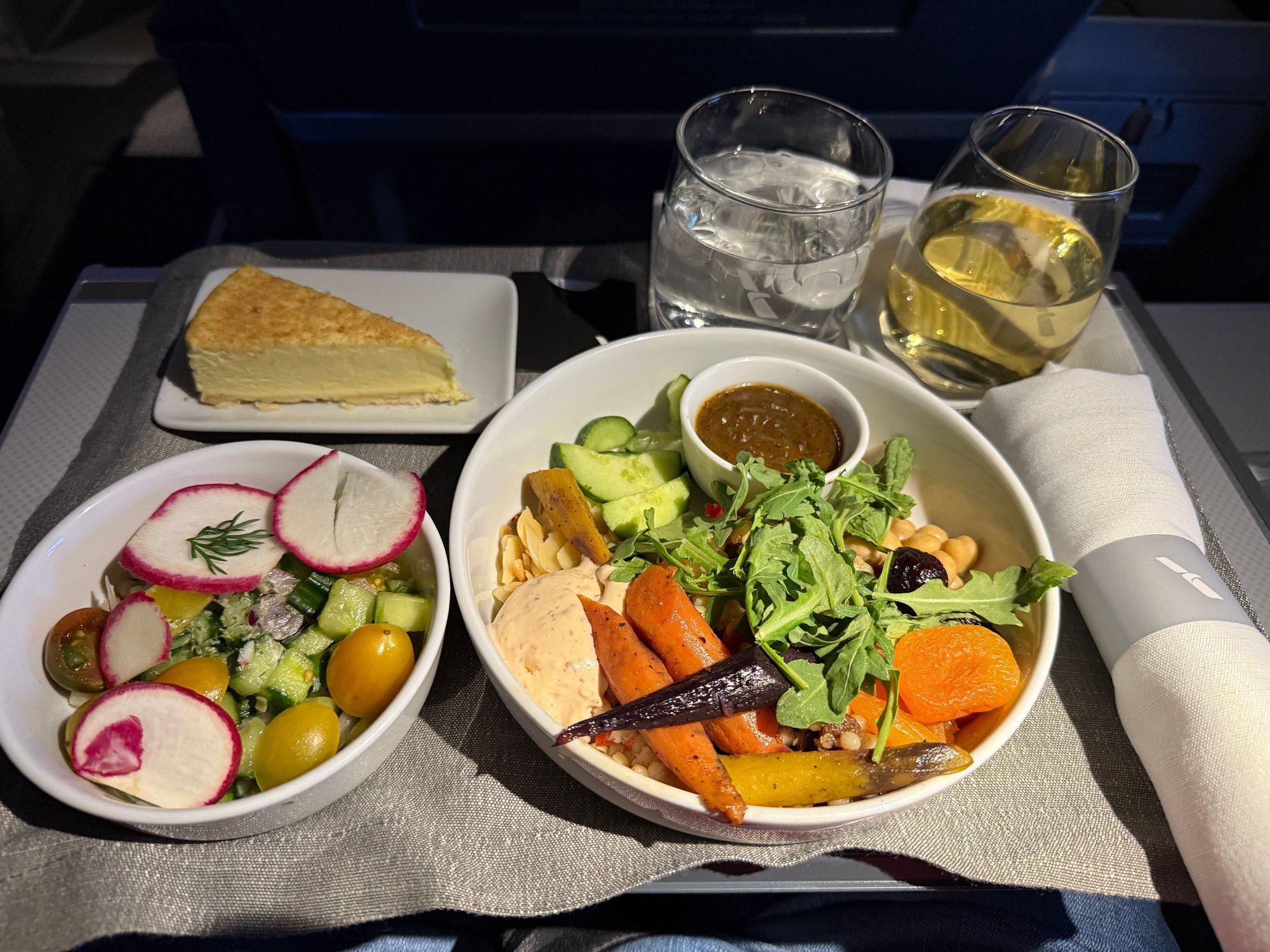 Moroccan Bowl - Couscous, roasted almond slices, mint, cumin, cinnamon, red bell pepper, cucumbers, raisins, dried apricot, dried fig, garbanzo beans, tricolored carrots, baby arugula, harissa aioli, sumac vinaigrette dressing