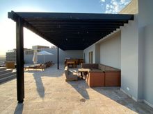 Rooftop - full bar, grill, and seating area