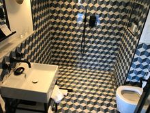 Bathroom with big flask amenities