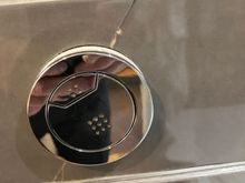 Cracked tiles around toilet flush