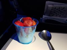 Bonus food smuggled from the United Club: vanilla yogurt, granola, strawberries.  I returned the spoon later!