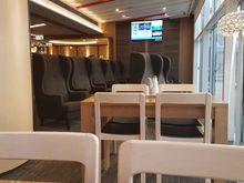 HKG Lounge, plenty of armchairs facing the planes
