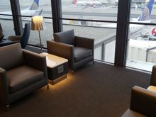 I would enjoy sitting in this area of the lounge watching planes all day.