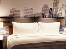 Behold: the bed! AC and usb on each side. In addition to bedside lamps, there are overhead (ceiling) lights, switches on each side controlling its half.