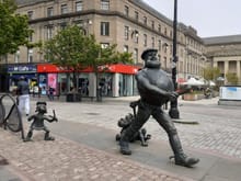 Desperate Dan statue ( could do with a bit of a clean) Caird hall to the right ( being used as a Covid vaccination centre).