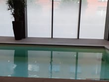 Pool ( nine window panes long) . 2 people can swing lengths but on the chair side of the pool there is an underwater bench running the length of the pool  with buttons at each pool end which when pressed creates small water jets from the side