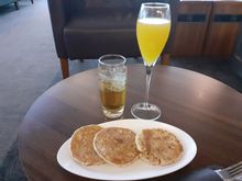 American pancakes with maple syrup, apple juice and Bucks Fizz