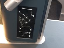 Remote stored below the headset.