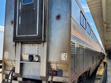 The rear view of one of the pieces of the train that were parked. If I recall correctly, there were two of these, one on either side of the platform structure (I say this because in most countries, they would be counted as two platforms). Each coach was identified by a number and we were instructed which coach was ours (based on the check-in information). As it turned out, this was our very coach. The three coaches here would be attached to the rear of the ones on the platform to the right.