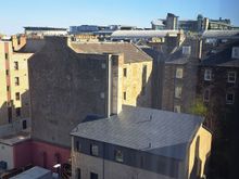 Side view from Rm 531. Top of the back of Edinburgh castle can be  just be seen jutting above the office building on the right side