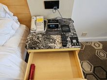 Bedside drawer with emergency torch.
Clock needs covered up as a little bit of light at night.