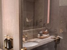 Shower with rainhead and handheld.
Toilet outside shower to right