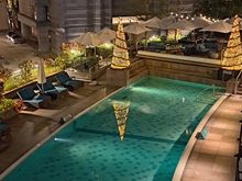 Pool at night ( closed at 10pm). Loved the christmas trees lit up