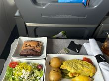 Same quality chicken as UA, the seasoning or golden part wasn't that great. Crew from LA hid in and talked to each other most of the flight.