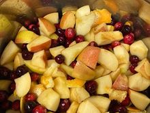 Apples, cranberries, orange zest, the juice from that orange, and water. 