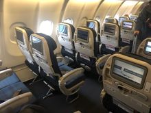 Economy class w those annoying SQ remote controllers.
