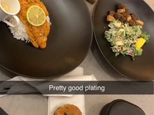 Fish was very good if small portioned. Cookie is from the bar, rest is ordered on app. Oranges and apples and hard candies available at bar. Salad had a lot of sauce. 
