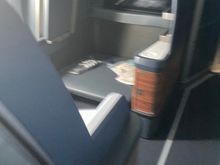 Seat 1A. Has a dedicated ottoman and increase in space.