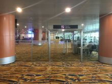 The proverbial transit/transfer security gate. Other side of that locked glass door is the departure side.