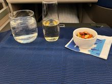 Snack & Drink - yes that was the fill level for champagne that I was handed and they didn’t offer nuts, so had to ask after the fact. 