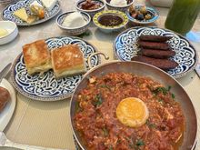 The warm dishes of the Turkish breakfast. Meneman, sujuk, and a cheese pastry