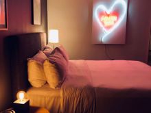 Comfortable bed with sassy lighting.
