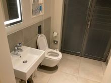 2nd room right of hallway: bathroom 1 with toilet & shower