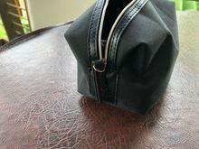 Zipper pull with red stitching