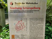 A large signpost explaining the origins of the Schüngelberg settlement 