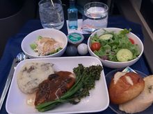 DEN-NRT. Chicken. Happy to be able to say this but it was very good. Even the “bang bang chicken” appetizer.  