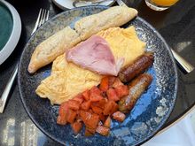 My mediocre chain hotel breakfast. Not shown are the fruits with yogurt I already finished and an airy pain au chocolat for dessert. 