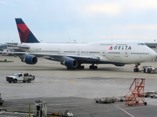 Delta 747 being pushed back from a gate at DTW in April, 2017. The plane was taken out of service at the end of the year and currently is in storage.