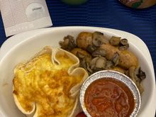 Breakfast on UA219 ORD-HNL 011/28/21:
Close up of entree - Leek quiche with breakfast sausage, potatoes, tomato and tomato sauce
