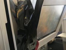 Combination of engineering tape and an infant seat belt being used to hold CW IFE screen in place due to broken hinge mechanism. Unrefurbished LGW 772. CSM told me she always carries a roll of the tape on those aircraft. It sort of worked. 