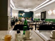 Part of the breakfast area (ground floor), to the left is the buffet area and a conservatory glassed seating area as well