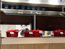 And here you see the communal kitchen windows open up to stock the warm buffet.... if you here the crackling sound, it is not the old fashioned departures board but fresh hot food being put out
