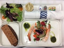 Appetizer shrimps with strawberry salad and small side salad