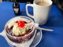 The ice cream was very soupy by the time the F/A's served it up, and I was towards the front of the cabin.  I agree with others that this ice cream seems lower-shelf.