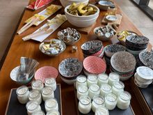 Yogurts, fruits and bread at breakfast