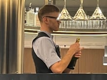 There was a long queu for service at a bar so though I will help myself for Champagne. He just shout NO and put sign ”wait for service” front of me. 