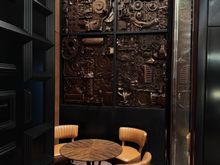 Private nook with artwork paying homage to the car factories of yesteryear. 