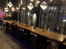 long seating area near the bar (on the left as you enter)