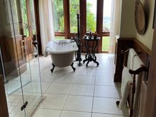 Bathroom with tub and standing shower