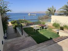 Two-tiered private garden leading to the private beach for villa guests