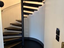 Spiral staircase to upper floor, reception was very attentive to suggest someone would escort us and bring our stuff upstairs