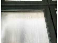 Our bedroom window. The cloudiness is not due to the rain, however, as it was frosted, since the only thing you would have been able to see was the building next door.