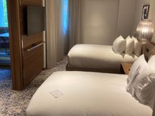 The bedroom has a TV and ample space