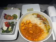 Paneer Makhani
jeera rice, spiced lentils with spinach and roasted peppers and onion.  It was about as good as an average frozen paneer meal one can buy at the grocery store.  I enjoyed it and always find Indian meals to be good on a plane since some of the spices/flavors break through my dulled senses at altitude.